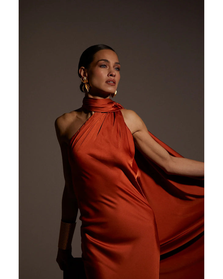 Elegant halter neck long dress in burnt orange silk with dramatic flowing fabric and high neckline — Kaoa | Endless UAE