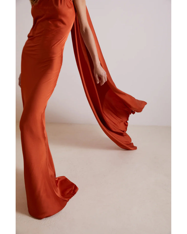 Burnt orange flowing maxi dress with dramatic draped sleeves and ruffled hem details — Kaoa | Endless UAE