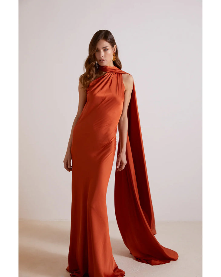 Elegant orange halter neck gown with dramatic cape detail and floor-length silhouette — Kaoa | Endless UAE