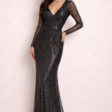 Elegant black glitter maxi dress with sheer long sleeves and V-neckline on model against pink background — Lipsy London | Endless UAE