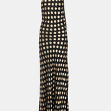 Black polka-dot one-shoulder maxi dress with flowing silhouette and knotted shoulder detail — Alexandra Miro | Endless UAE