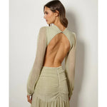 Woman wearing The Goddess Green Dress by Anne Louise Boutique — Endless UAE