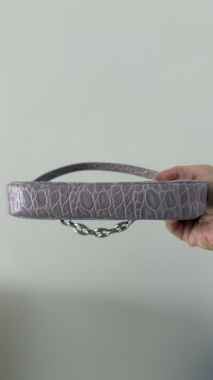 Mini Rachel Lilac Croco Embossed Leather Bag held in hand against white background — By Far | Endless UAE