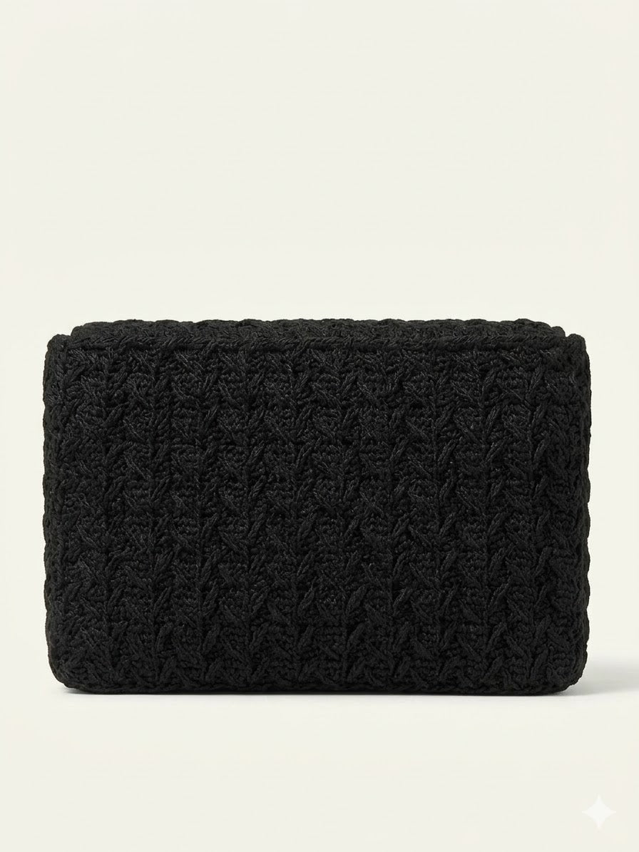 Black woven raffia clutch bag with textured basket weave pattern and structured rectangular shape — Jimmy Choo | Endless UAE