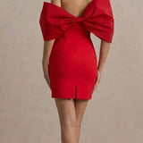 Red off-shoulder mini dress with dramatic oversized bow detail at back, fitted silhouette and center back slit — Club L | Endless UAE