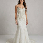 Ivory mermaid wedding gown with beaded bodice and embellished skirt — Enzoani | Endless UAE