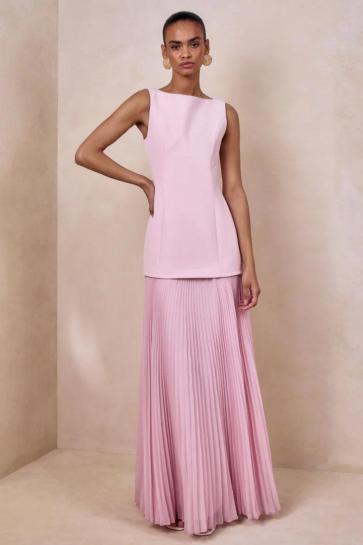 Woman wearing light pink sleeveless boat-neck maxi dress with pleated skirt — Club L London | Endless UAE