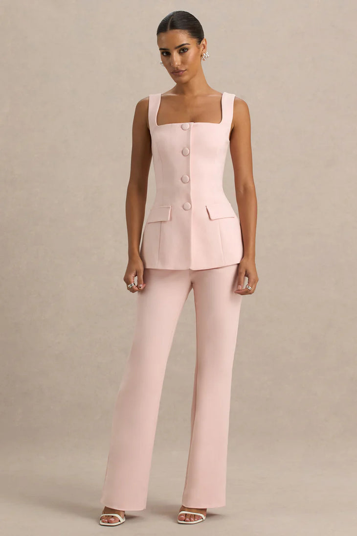 Blush pink sleeveless tailored suit set with button-front top and wide-leg trousers paired with white heeled sandals — Club L London | Endless UAE