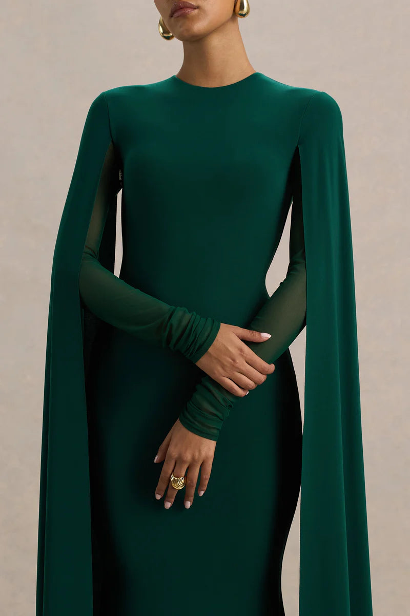 Woman wearing bottle green maxi dress with cape sleeves and crew neckline — Club L London | Endless UAE