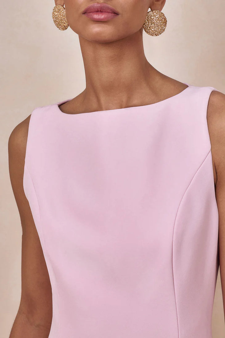 Woman wearing light pink sleeveless boat-neck maxi dress with pleated skirt — Club L London | Endless UAE