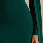 Woman wearing bottle green maxi dress with cape sleeves and crew neckline — Club L London | Endless UAE