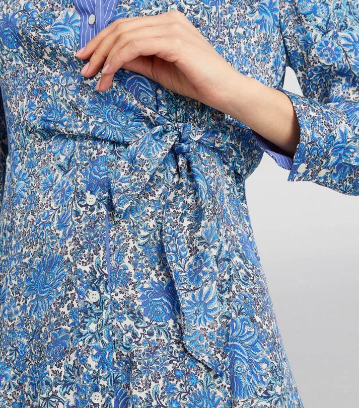 Woman wearing blue floral print midi dress with tie waist detail and long sleeves — Sandro | Endless UAE