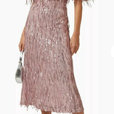 Woman wearing a dusty pink sequin fringe midi dress with puffed sleeves — Endless | Endless UAE