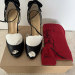 Black leather peep-toe platform pumps with bow detail and lace-up ankle straps — Christian Louboutin | Endless UAE