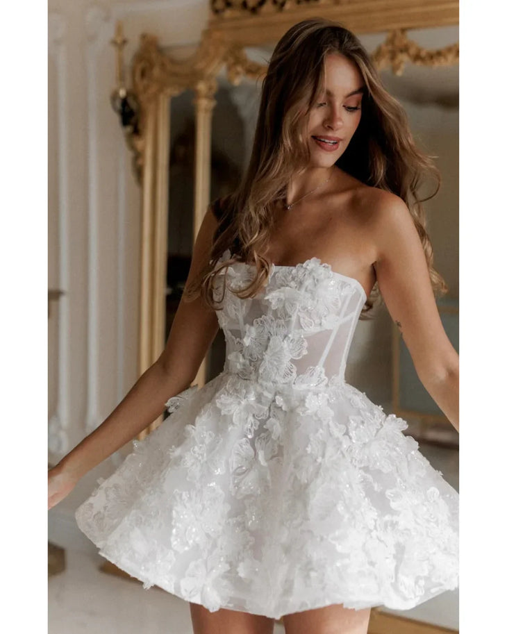 White strapless lace dress with textured floral details and fitted bodice — Rosie Etienne | Endless UAE