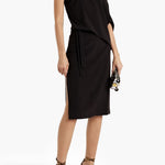 Black one-shoulder draped stretch-crepe dress with belted waist and side slit on model — Halston | Endless UAE