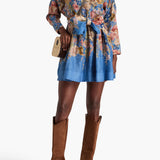 Belted floral-print linen mini dress in blue with long sleeves and bow detail — Zimmerman | Endless UAE
