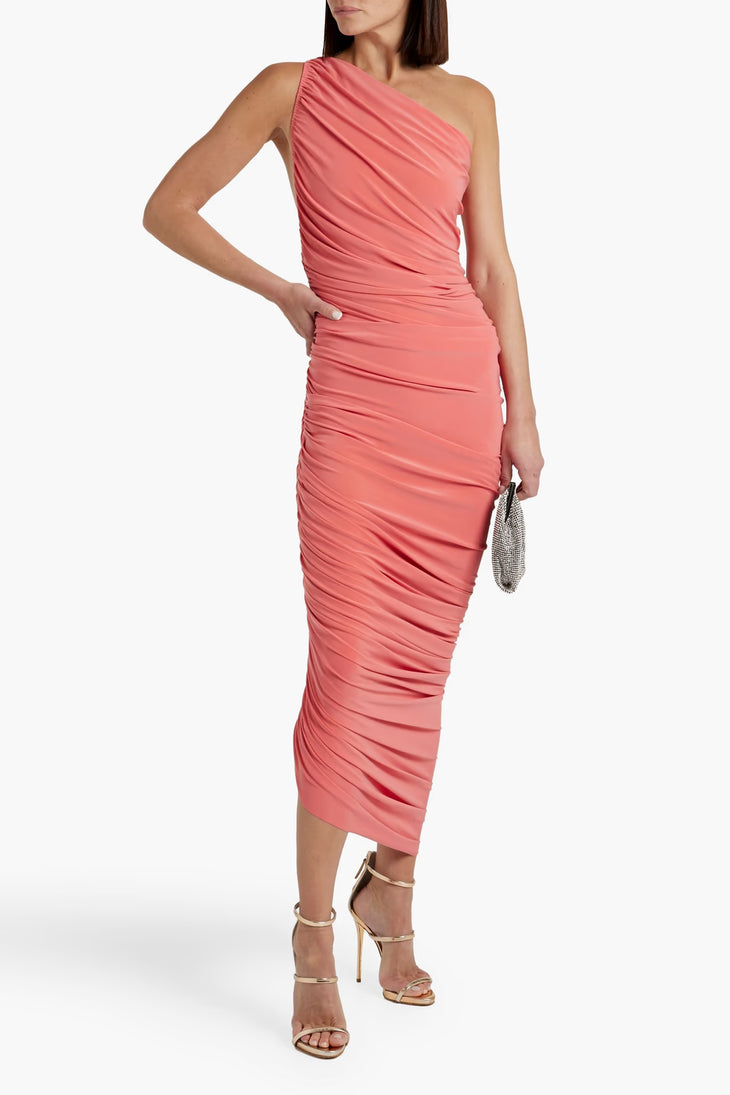 Woman wearing a coral one-shoulder ruched midi dress with metallic heels and clutch — Norma Kamali | Endless UAE