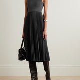 Elegant charcoal grey sleeveless midi dress with fitted bodice and pleated satin skirt, styled with black knee-high boots — Theory | Endless UAE