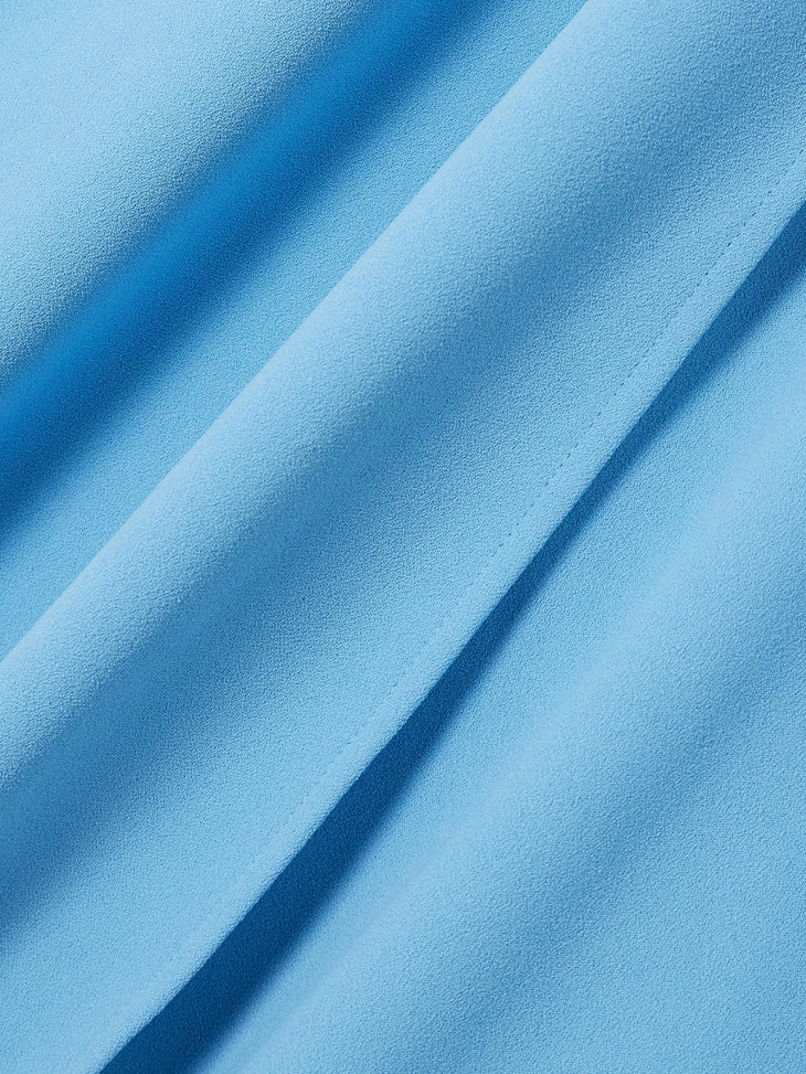Flowing blue cape-sleeve maxi dress with elegant draping and subtle texture detail — Solace London | Endless UAE