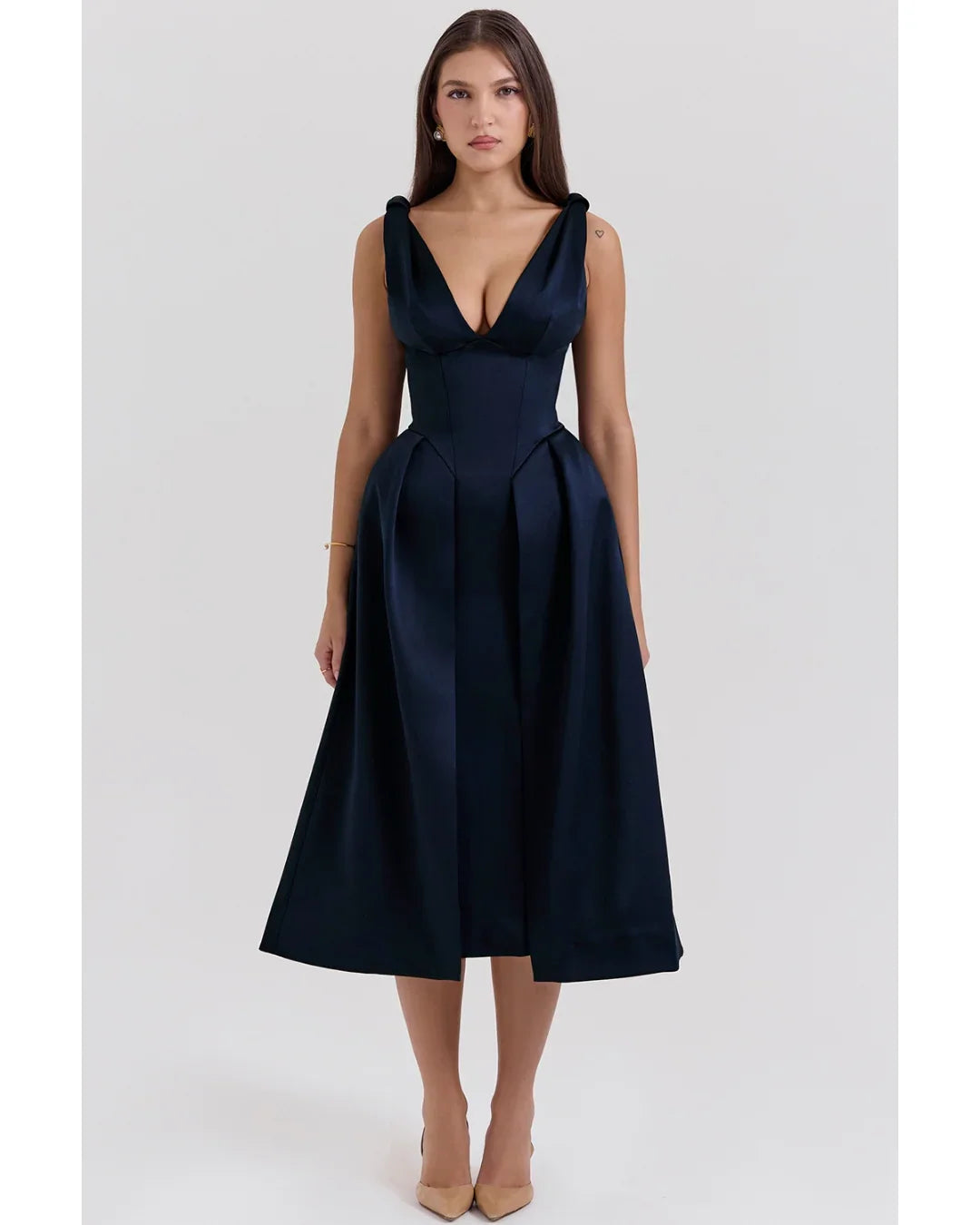 Woman wearing navy blue satin midi dress with twisted shoulder straps and full skirt — House of CB | Endless UAE