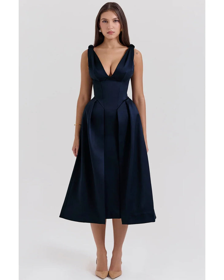 Woman wearing navy blue satin midi dress with twisted shoulder straps and full skirt — House of CB | Endless UAE