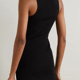 Black ribbed-knit mini dress with cutout detail and gold-tone embellishment, shown from back view — Coperni | Endless UAE