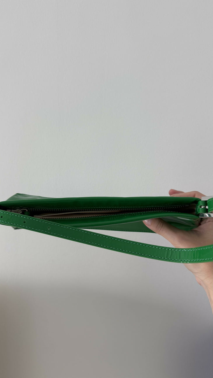 Dulce Patent Leather Shoulder Bag in vibrant green, held up against neutral background — By Far | Endless UAE