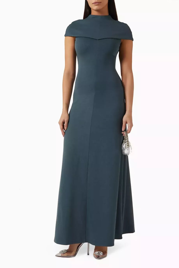 Dark teal fitted maxi dress with draped cap sleeves and mock neckline, styled with embellished heels and metallic clutch — Odd Muse | Endless UAE