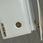 White leather shoulder bag with gold Jacquemus logo — Jacquemus | Endless UAE