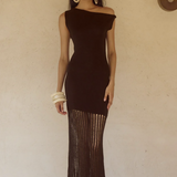 Woman wearing black off-shoulder knit maxi dress with fringe hem and white bangles — Endless | Endless UAE