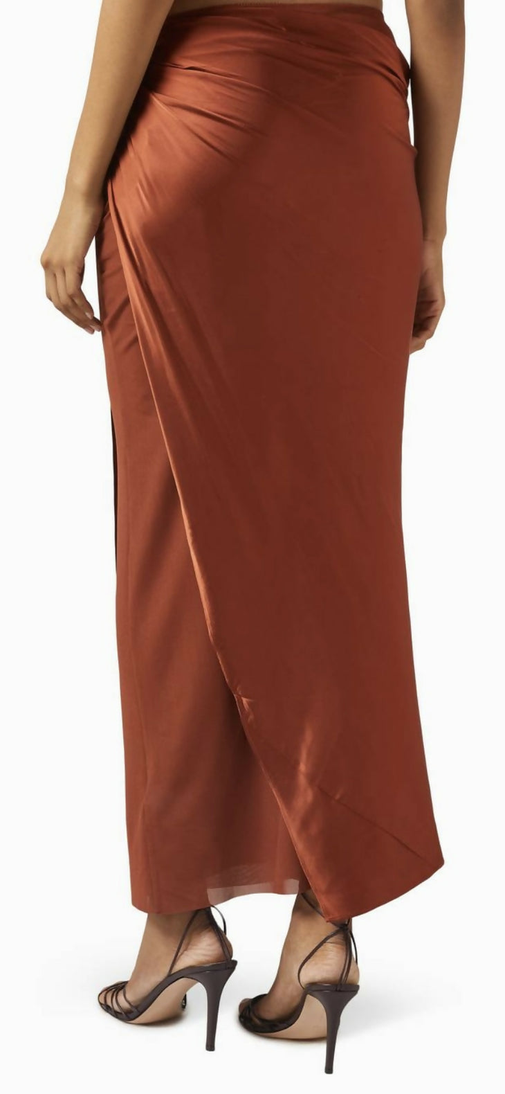 Rust brown satin maxi skirt with side slit, worn with black strappy heels — Significant Other | Endless UAE