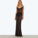 Blonde model wearing black sheer polka dot maxi dress with cowl neckline and figure-hugging silhouette — Rat & Boa | Endless UAE