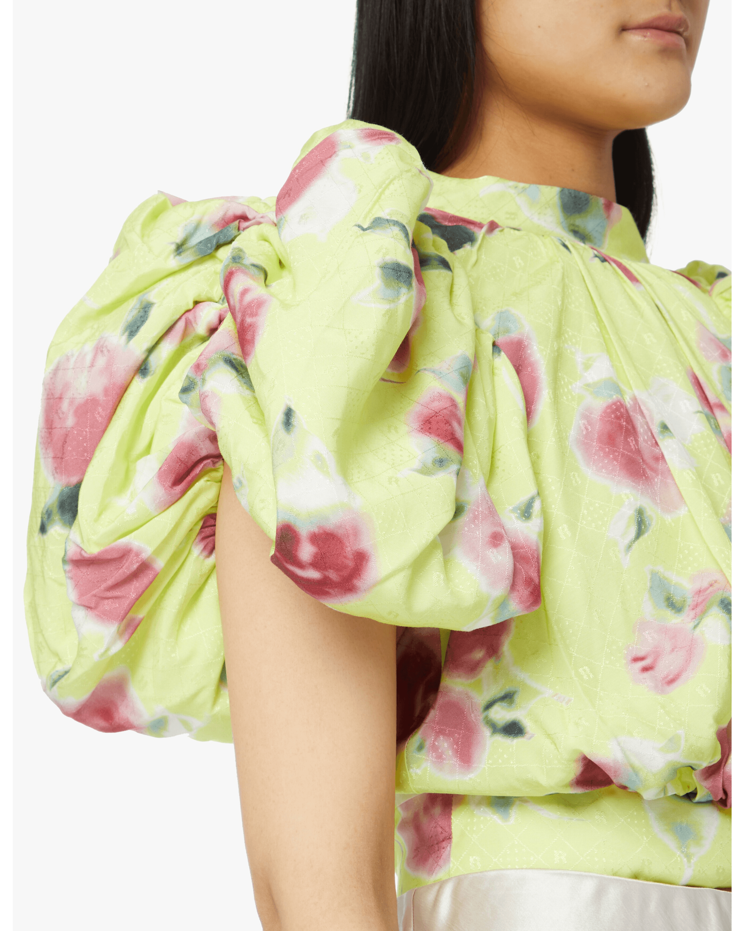 Woman wearing yellow floral puff-sleeve top with white midi skirt and blue sandals — Rotate Birger Christensen | Endless UAE