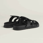 Black leather fisherman sandals with woven straps and adjustable buckle closure on treaded rubber sole — Hermes | Endless UAE