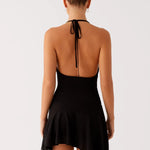 Black halter mini dress with open back and asymmetric hem — Peppermayo | Endless UAE