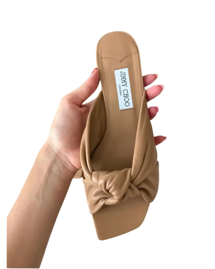 Beige leather flat sandal with twisted knot detail and black sole — Jimmy Choo | Endless UAE