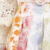 High-rise pleated floral-print poplin mini skirt with colorful pastel blooms — Zimmermann | Endless UAE