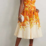 Woman wearing orange and yellow floral-print midi dress with spaghetti straps and fit-and-flare silhouette — Zimmermann | Endless UAE